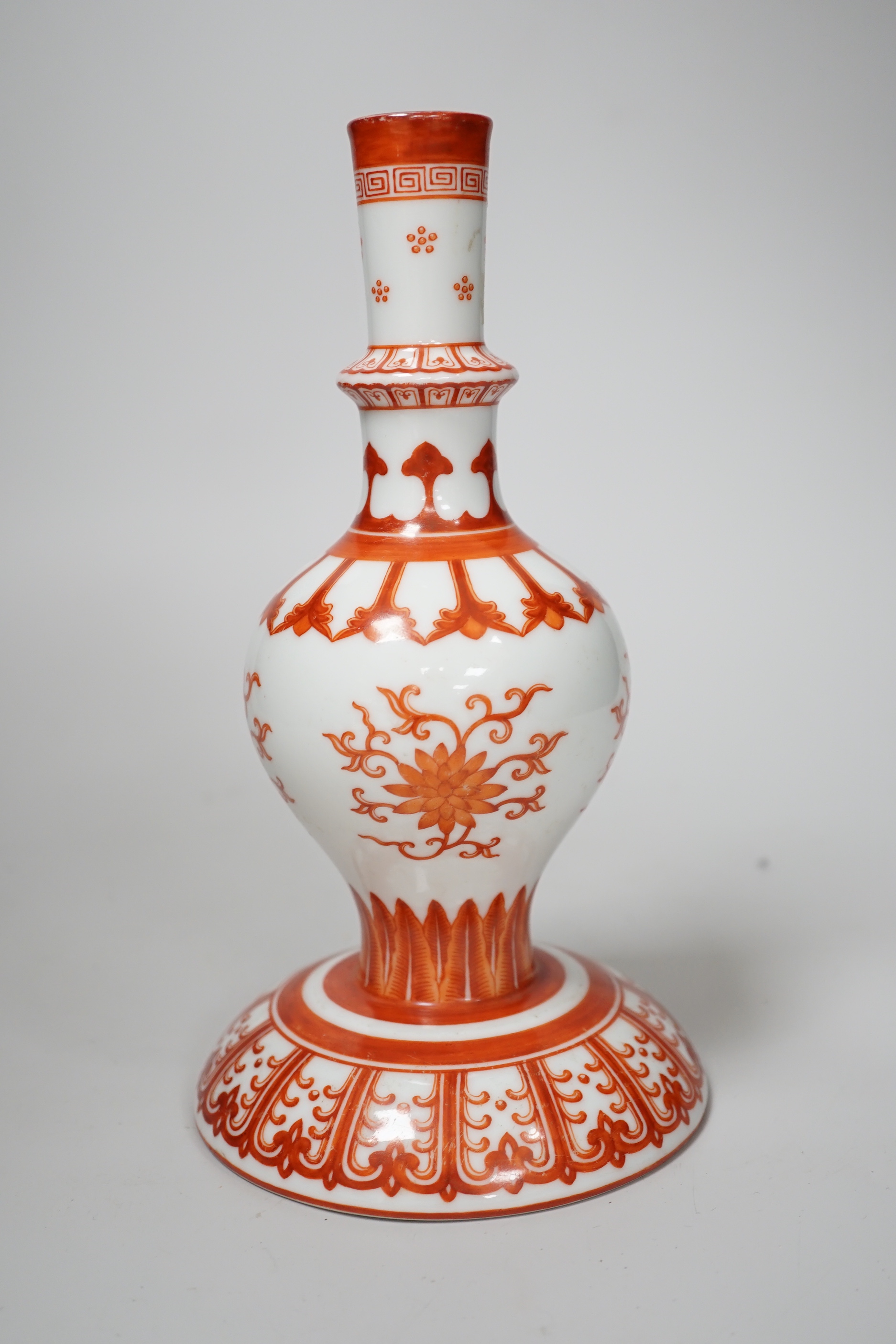 A Chinese candlestick hand painted with flowers with fitted case, 23cm high